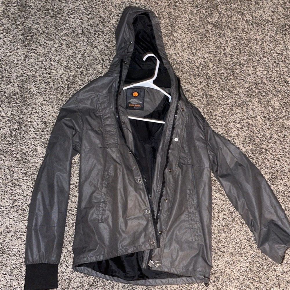 Not sure what brand, but medium grey/brown and black rain coat.